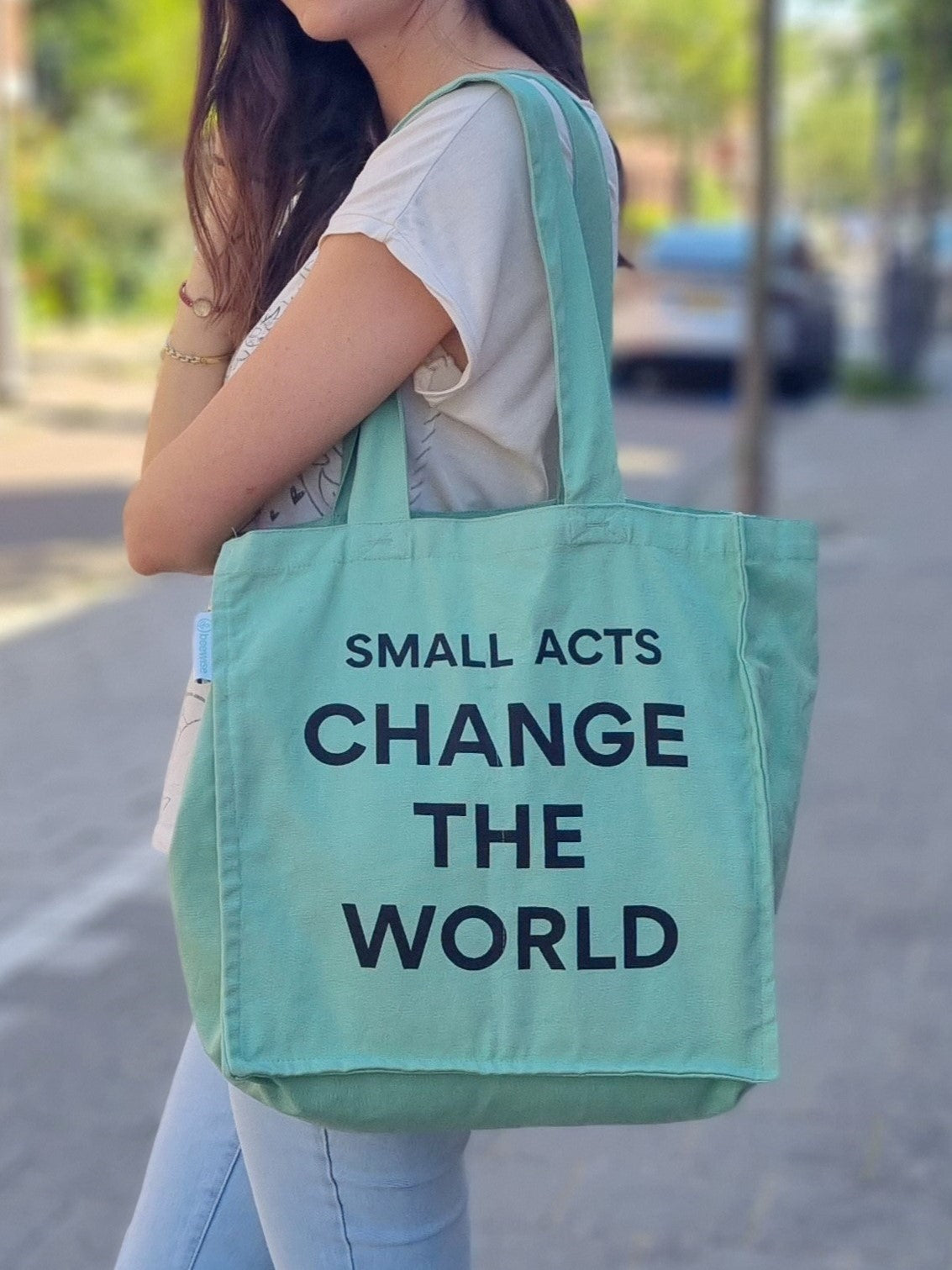grocery tote bag with six internal pockets and with the quote 'small acts change the world'