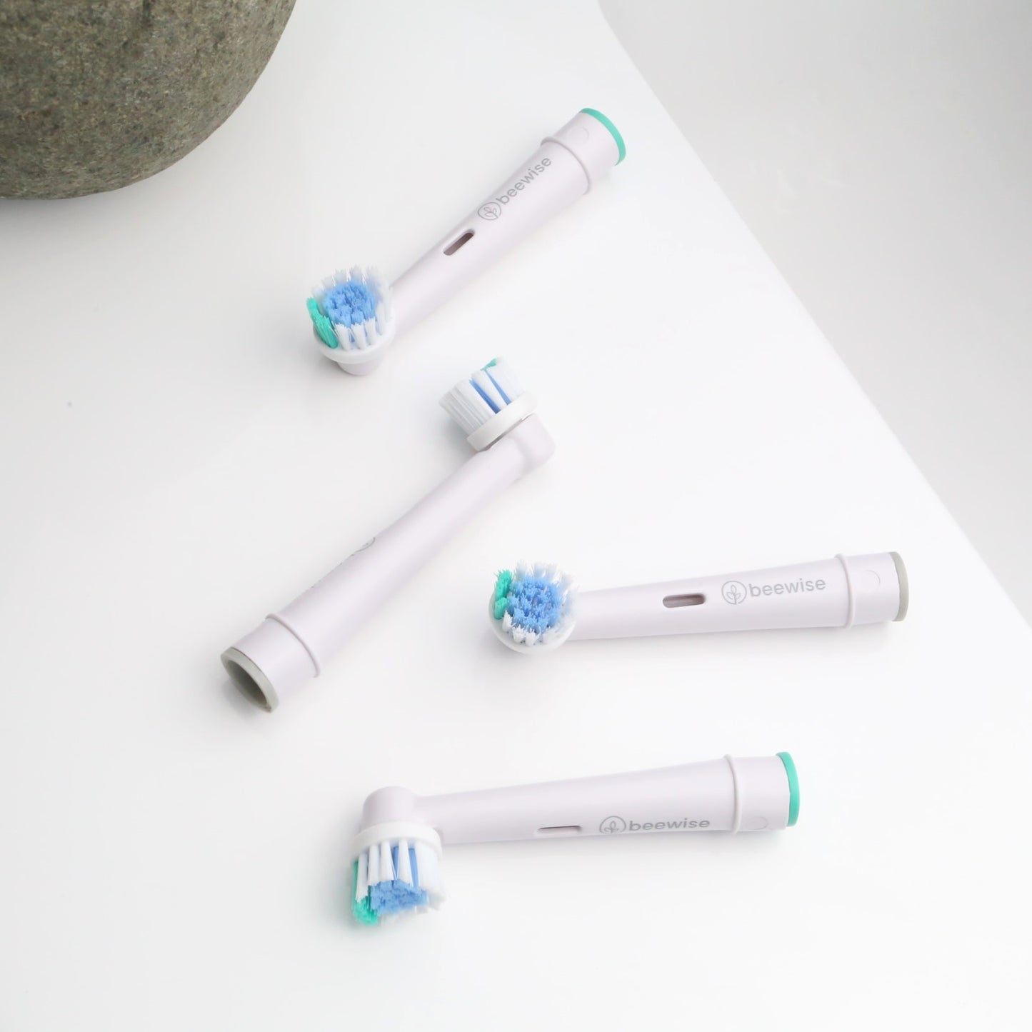 4 Recycled Electric Toothbrush Heads for Oral-B® – Eco-Friendly Replacement Heads on the sink of a bathroom
