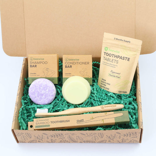 eco gift box with sustainable products with shampoo bars toothpaste tablets and bamboo toothbrush