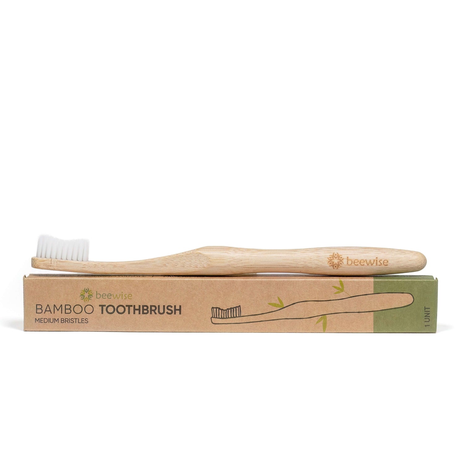 bamboo toothbrush with medium bristles beewise amsterdam showing on top of paper packaging