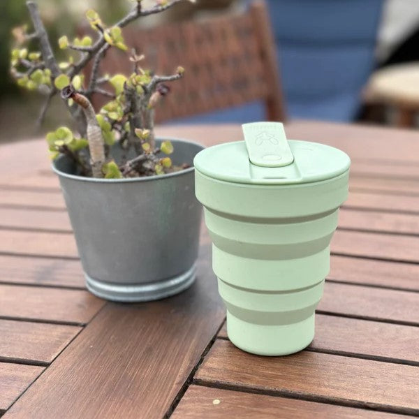 collapsible silicone reusable travel cup hunu sage green colour together with beewise