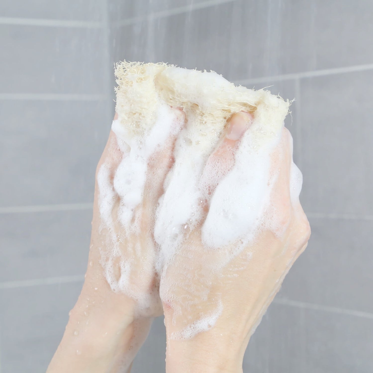 loofah sponge zero waste natural loofah from egypt showing making some bubbles on the hands of an adult