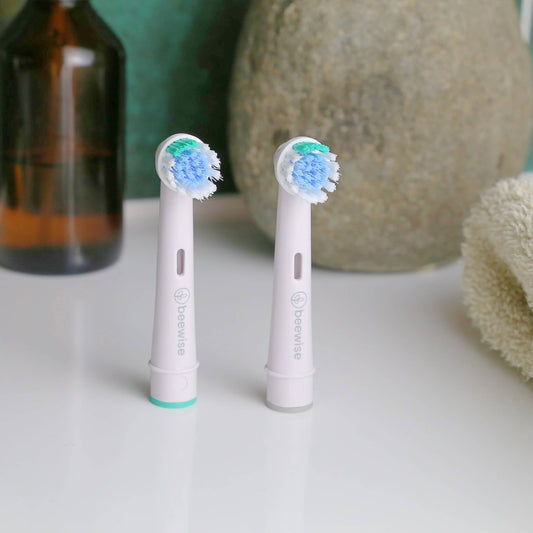 2-Pack Recycled Electric Toothbrush Heads for Oral-B® – Eco-Friendly Replacement Heads on the sink of a bathroom