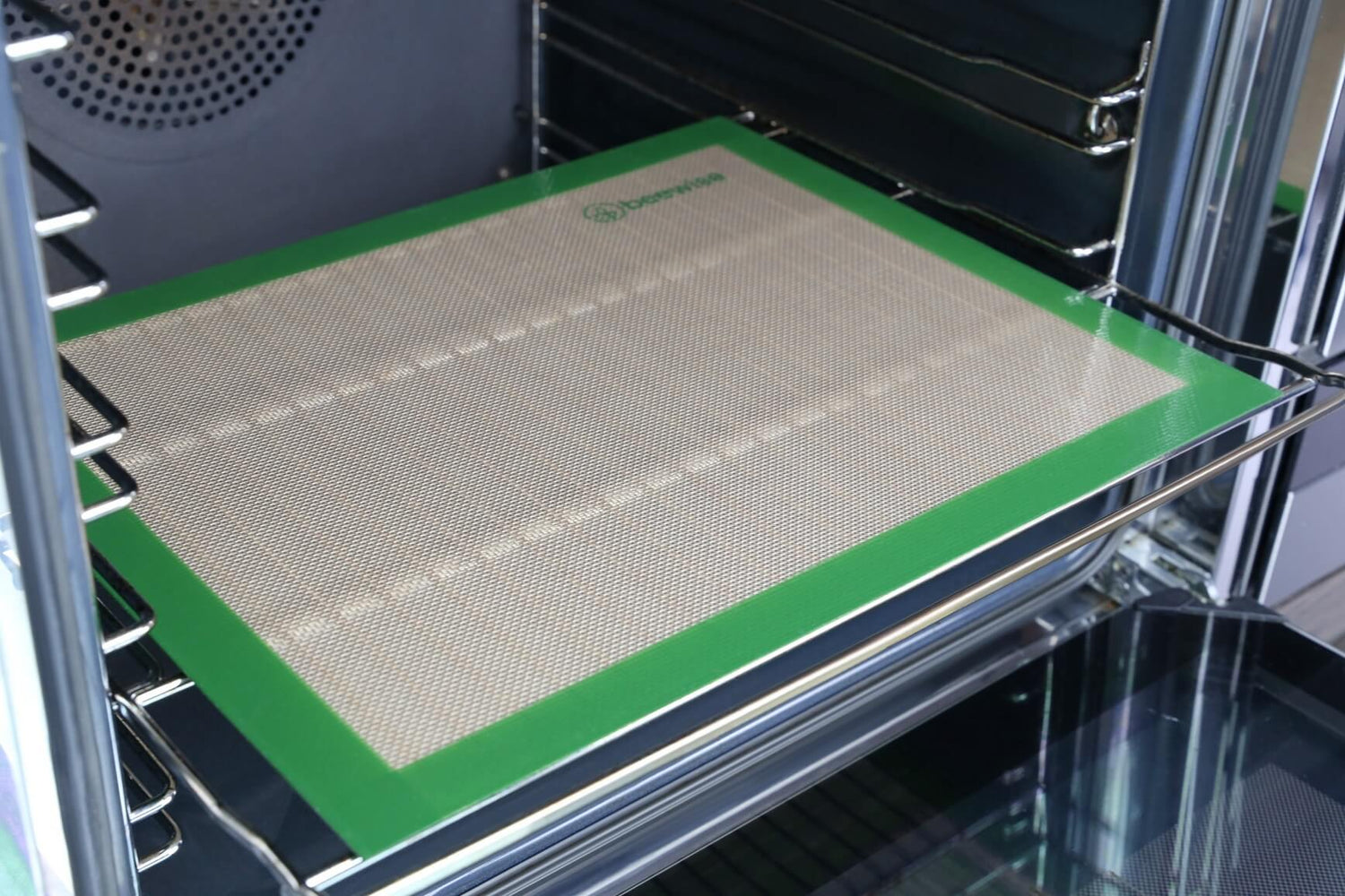 zero waste reusable silicone baking mat being used inside an oven made in europe 