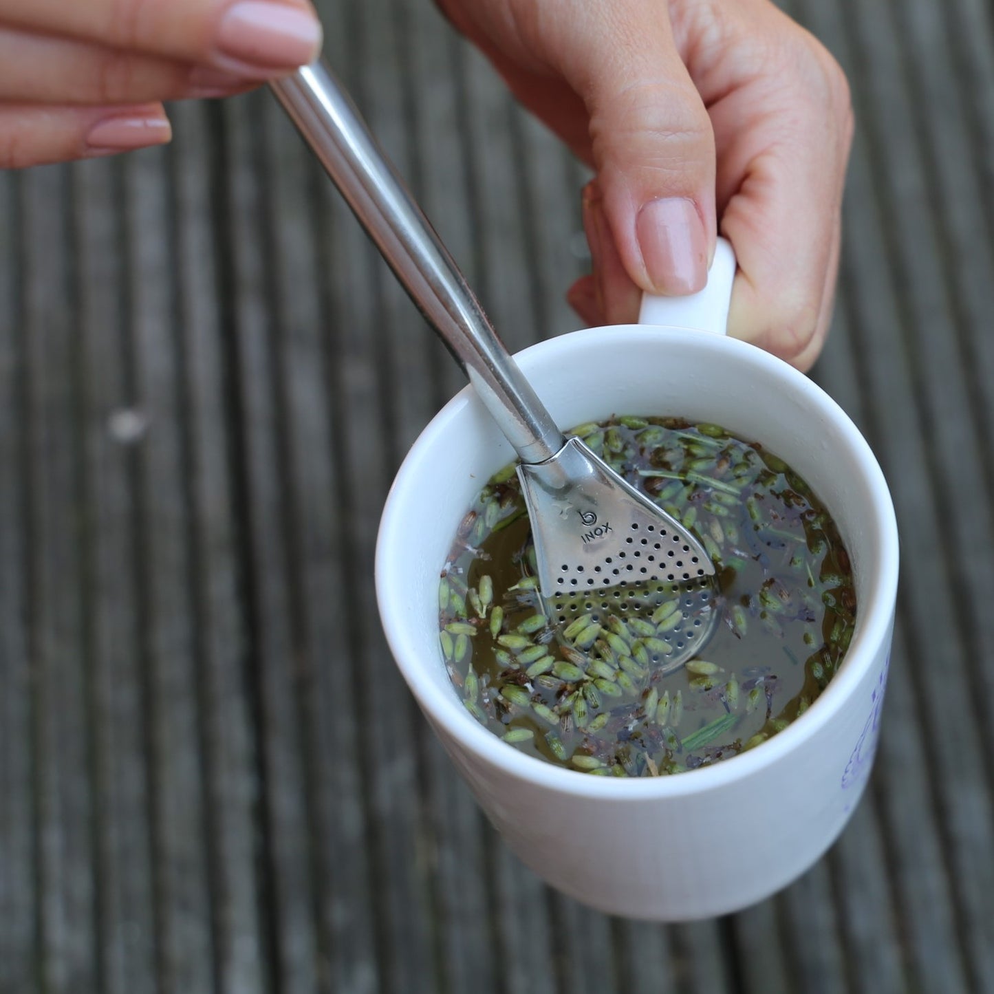 tea straw and strainer made of stainless steel being used for a lavanda tea