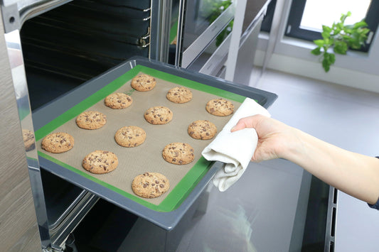 plastic-free reusable silicone baking mat made in europe being used to cook cookies