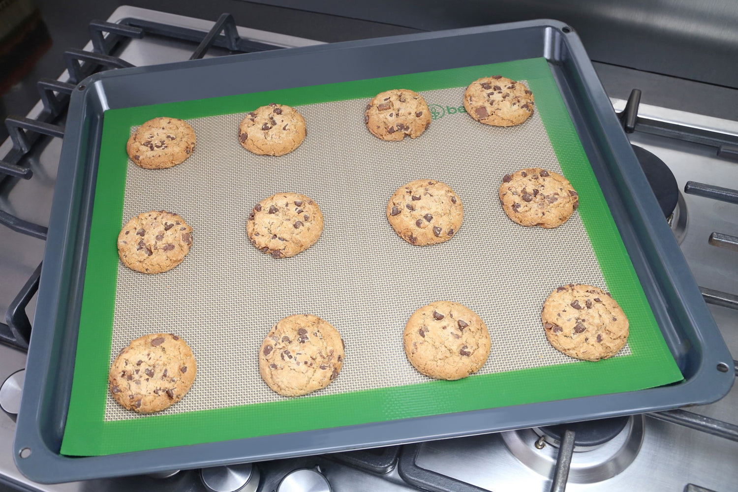 reusable silicone baking mat made in europe being used to bake cookies