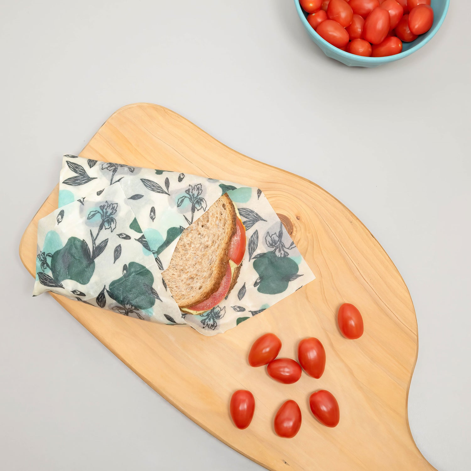 vegan food wraps made with organic cotton being used as a sandwich bag and tomatoes