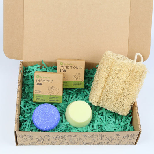 eco gift box with sustainable products with shampoo and conditioner bar and loofah sponge