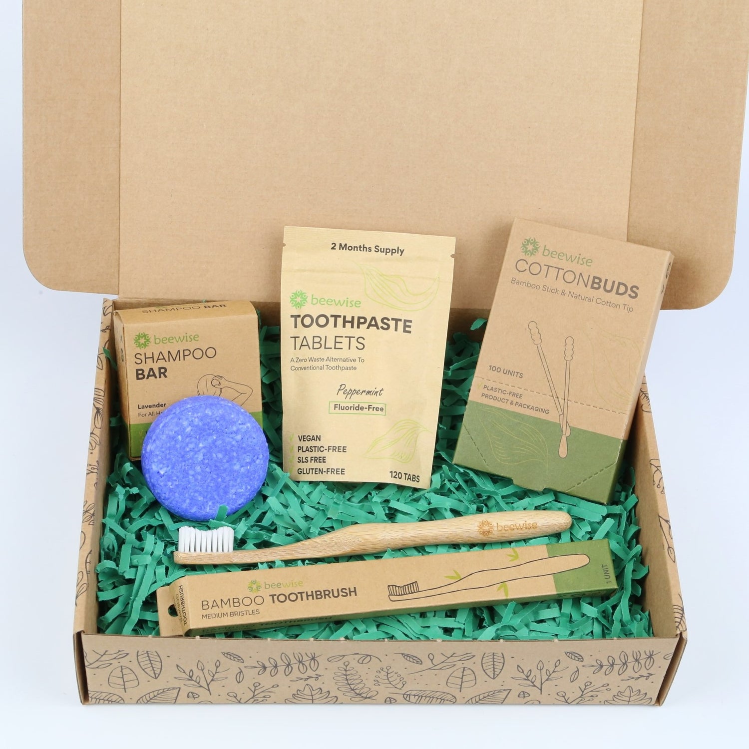eco gift box with sustainable products with shampoo bar cotton buds and bamboo toothbrush and toothpaste tablets