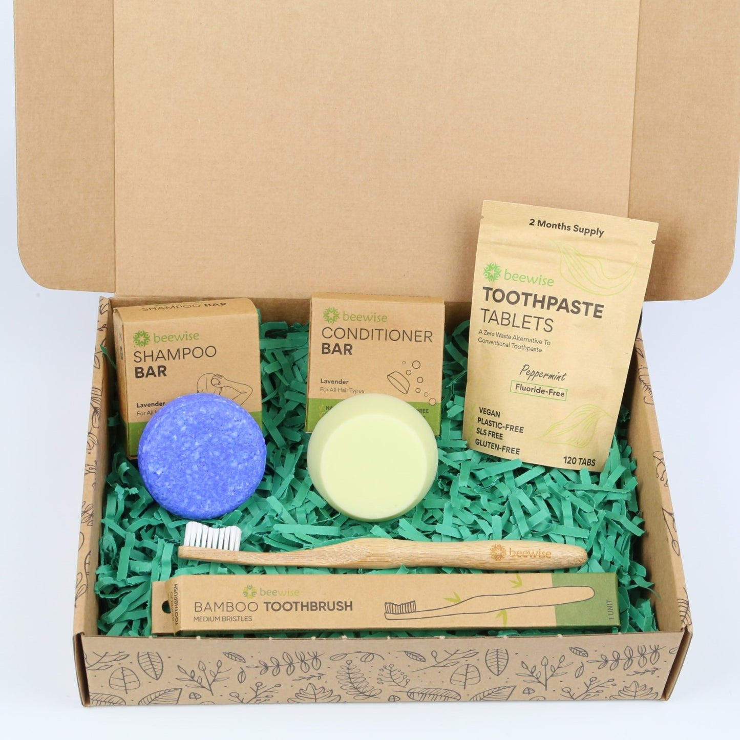eco gift box with sustainable products with shampoo bar toothpaste tablets and bamboo toothbrush