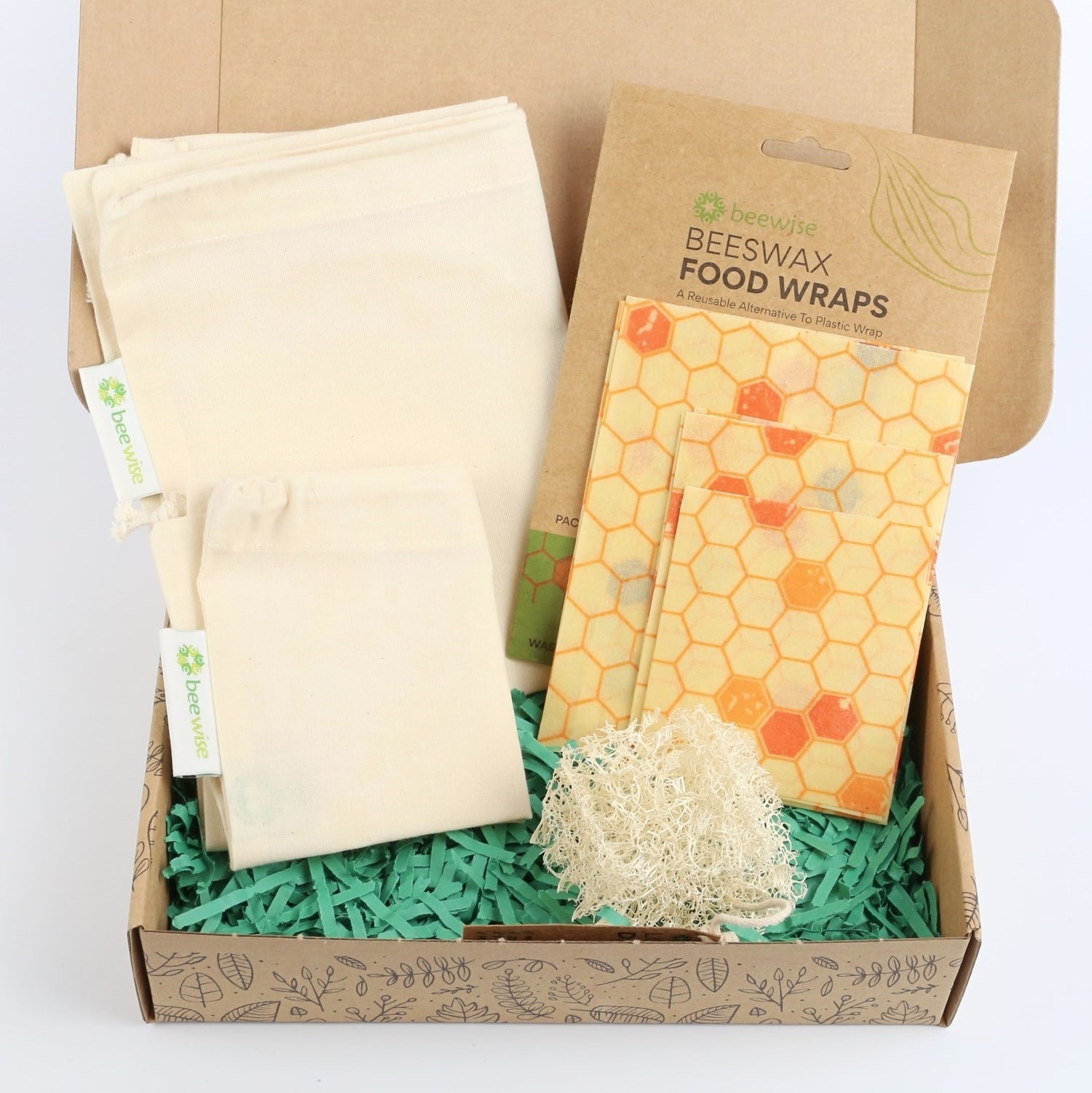 eco gift box with sustainable products with produce cotton bags, beeswax wraps and loofah dish sponge