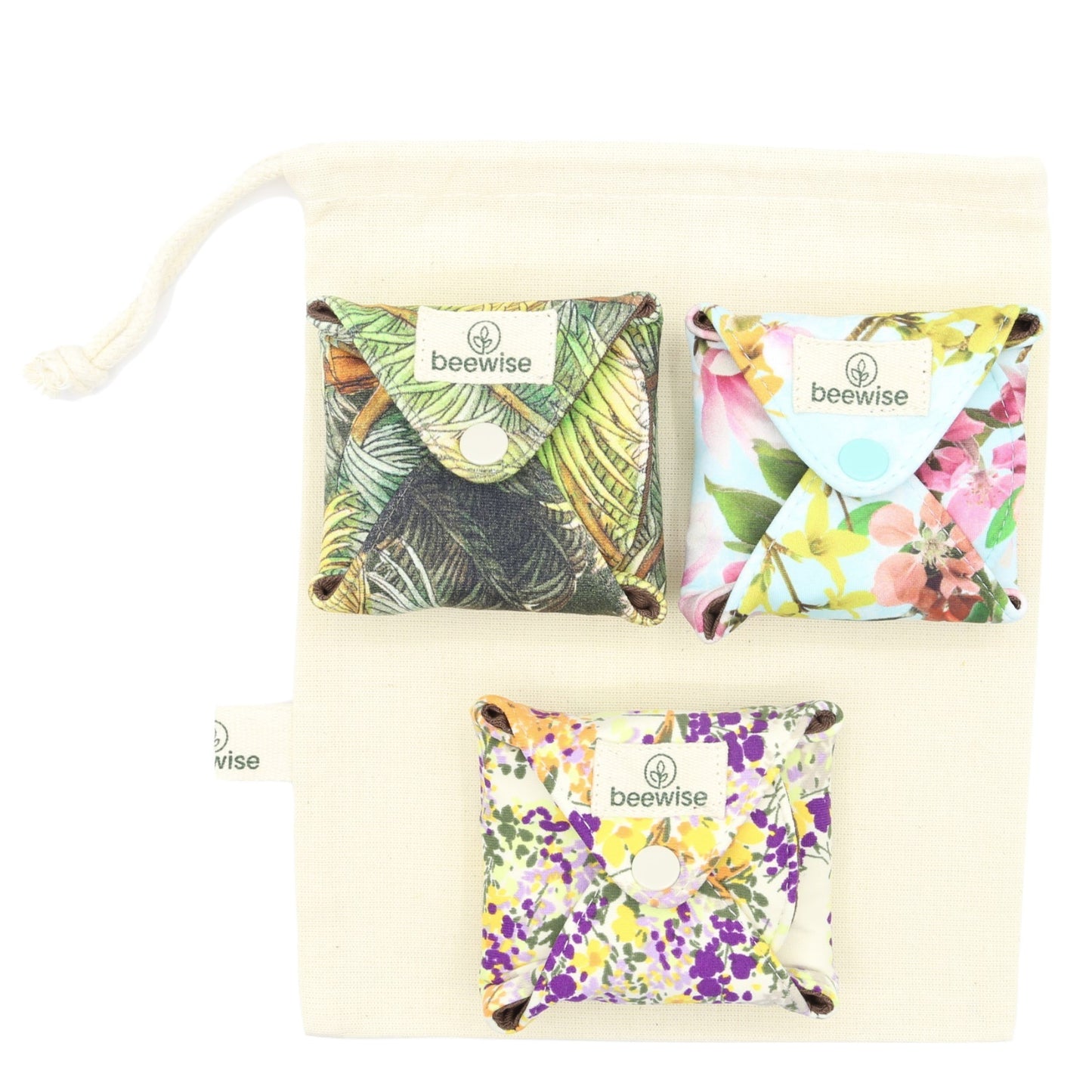 reusable menstrual pads made in brazil with cotton and a colourful green pattern set of 3 in a cotton bag