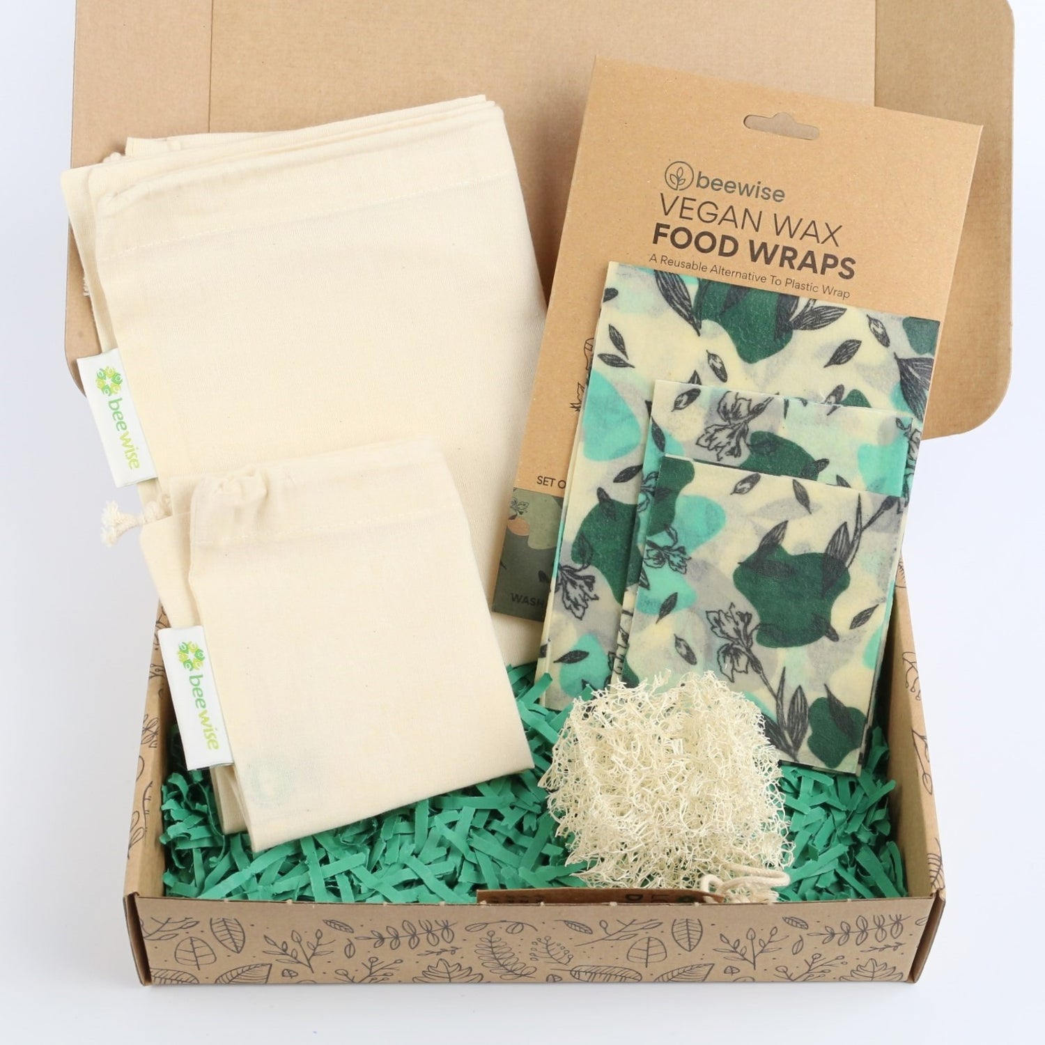 eco gift box with sustainable products with produce cotton bags, vegan wraps and loofah dish sponge