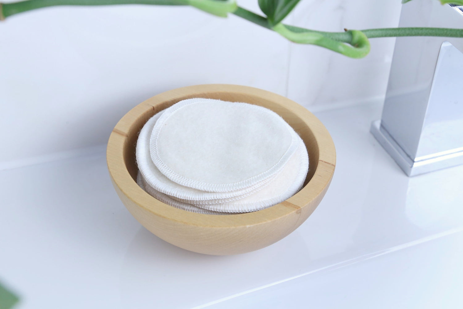 Reusable Makeup Remover Pads showing on the bathroom inside a wood container